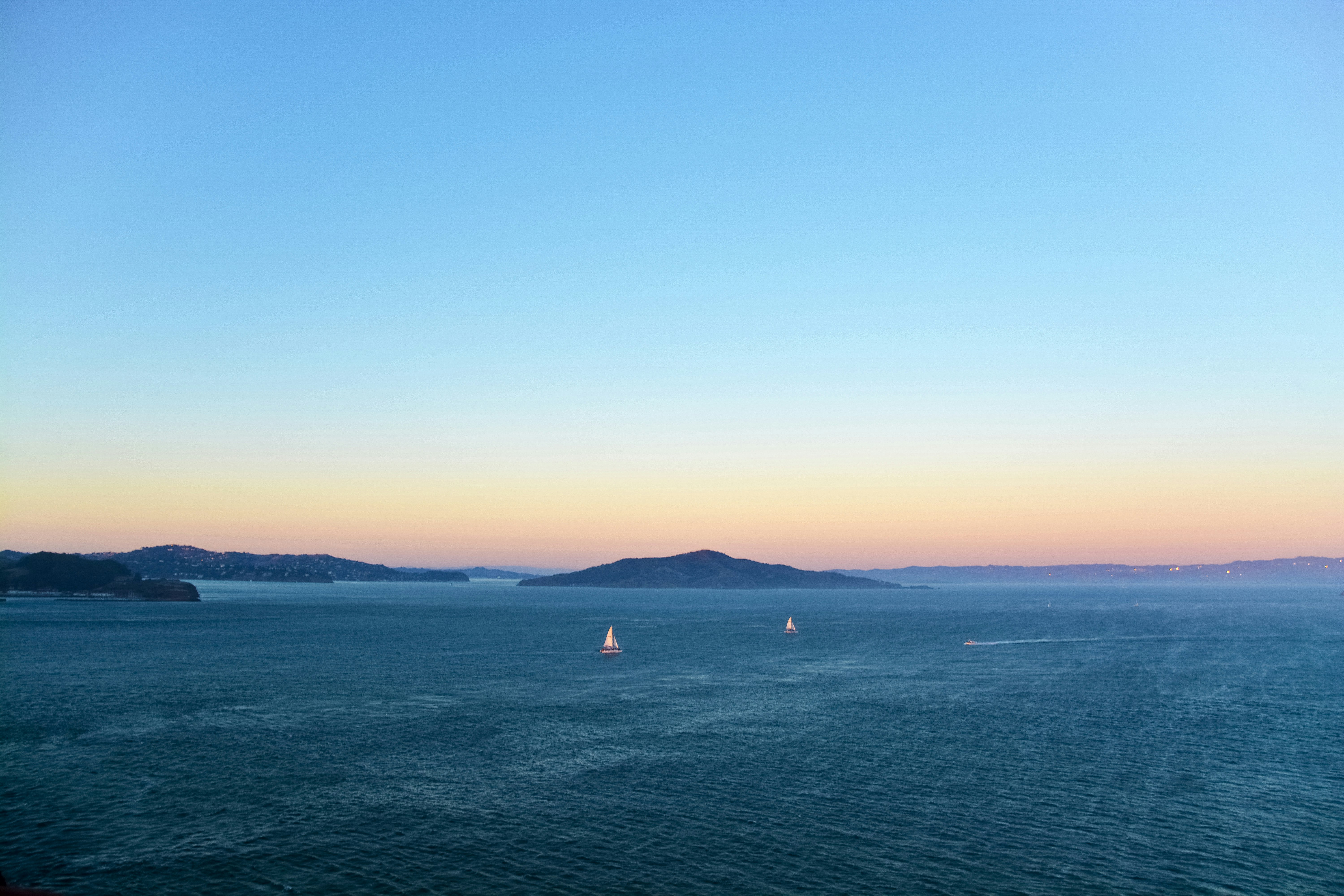 body of water under blue sky during daytime